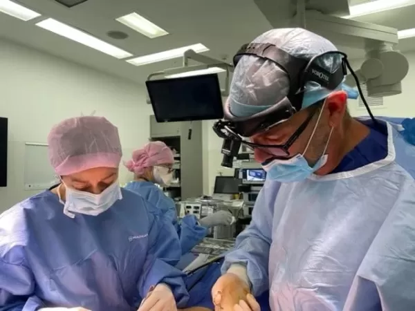 Dr Maryam 8 in theatre Surgical and Non-Surgical Solutions for Excess Neck Skin - 1