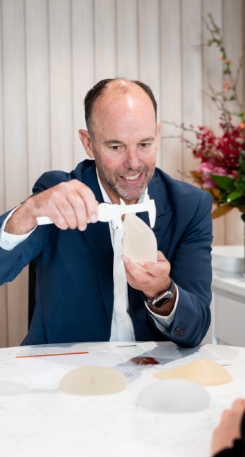 Dr Hunt explaining the right size of breast implants during breast surgery consultation 02